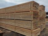 Sawn timber of pine. Delivery by wagons. - photo 1